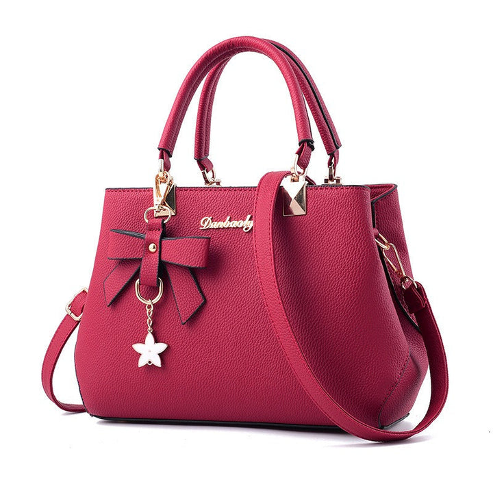 Nirela - Shell Silhouette Coated Finish Handbag